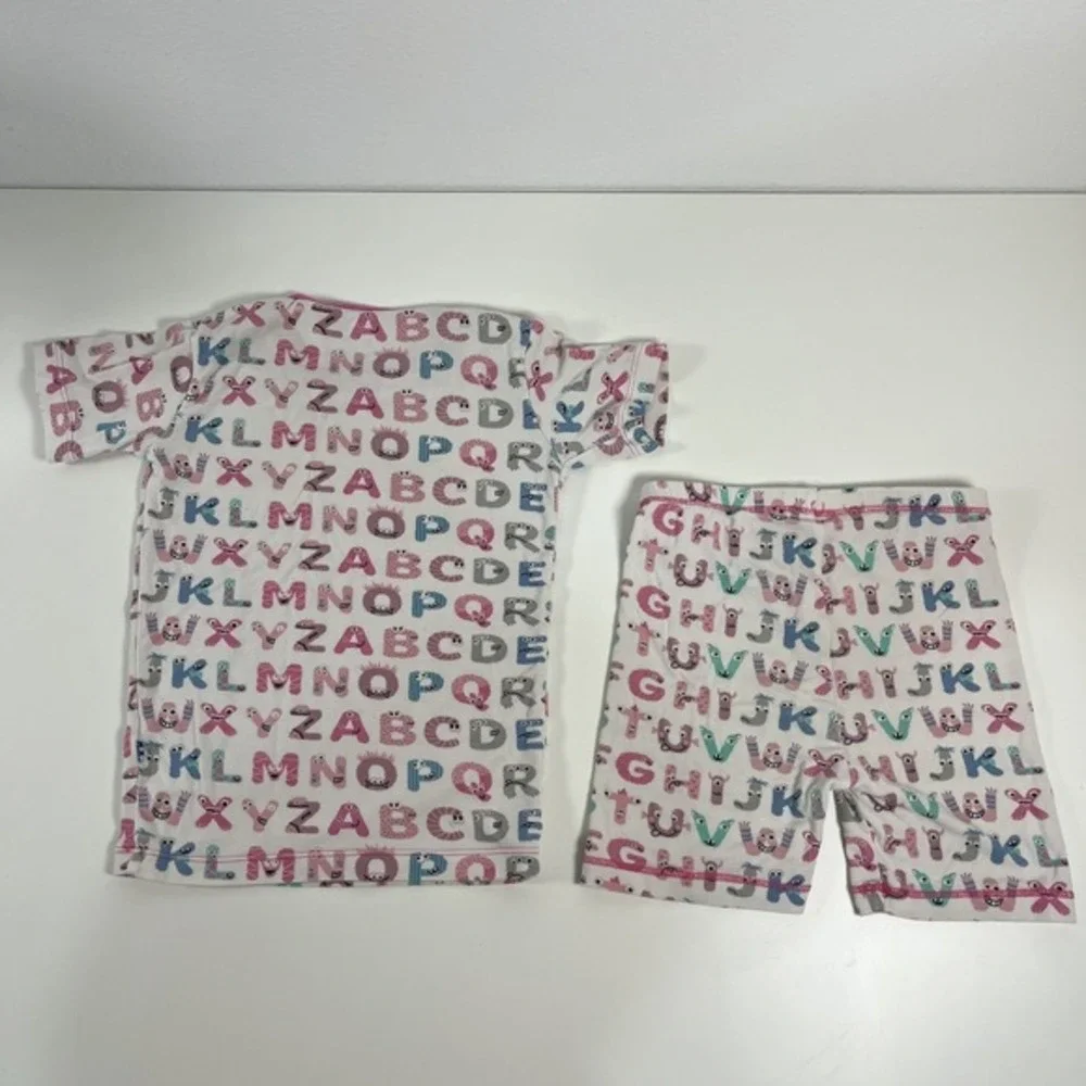 KicKee Graphic Short Sleeve Pajama Set, Ultra Soft and Snug Natural ABC Monsters